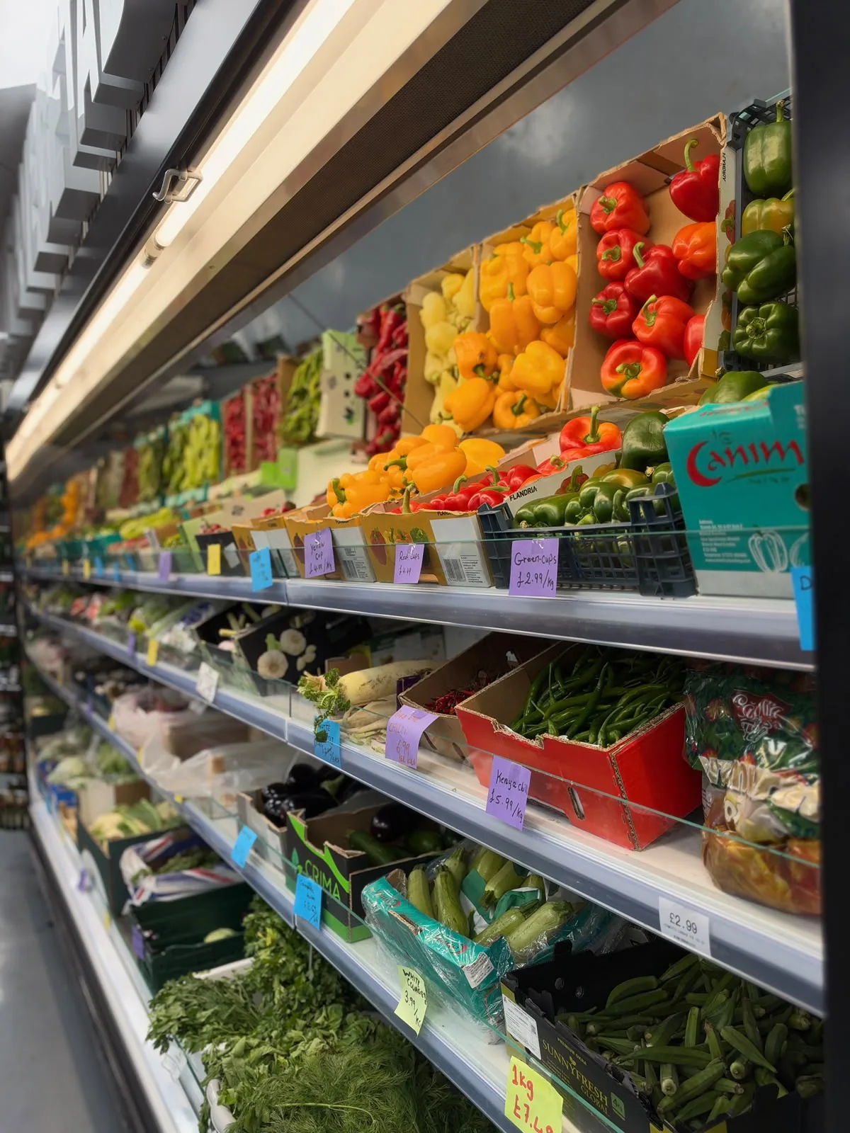 The colourful fresh fruit and vegetable area at Day View, with peppers, courgettes and fresh herbs